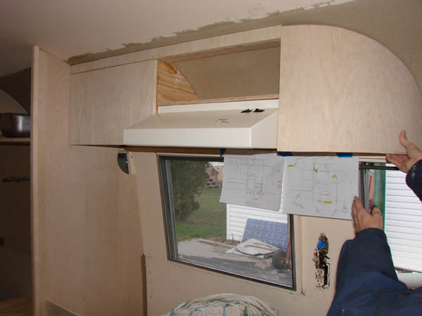 Cabinets above kitchen area.