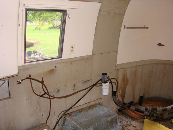 Front of the camper stripped of cabinets.