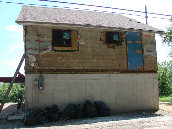 Side of the house with the siding off.