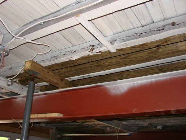 Rotted beam with sister beams.